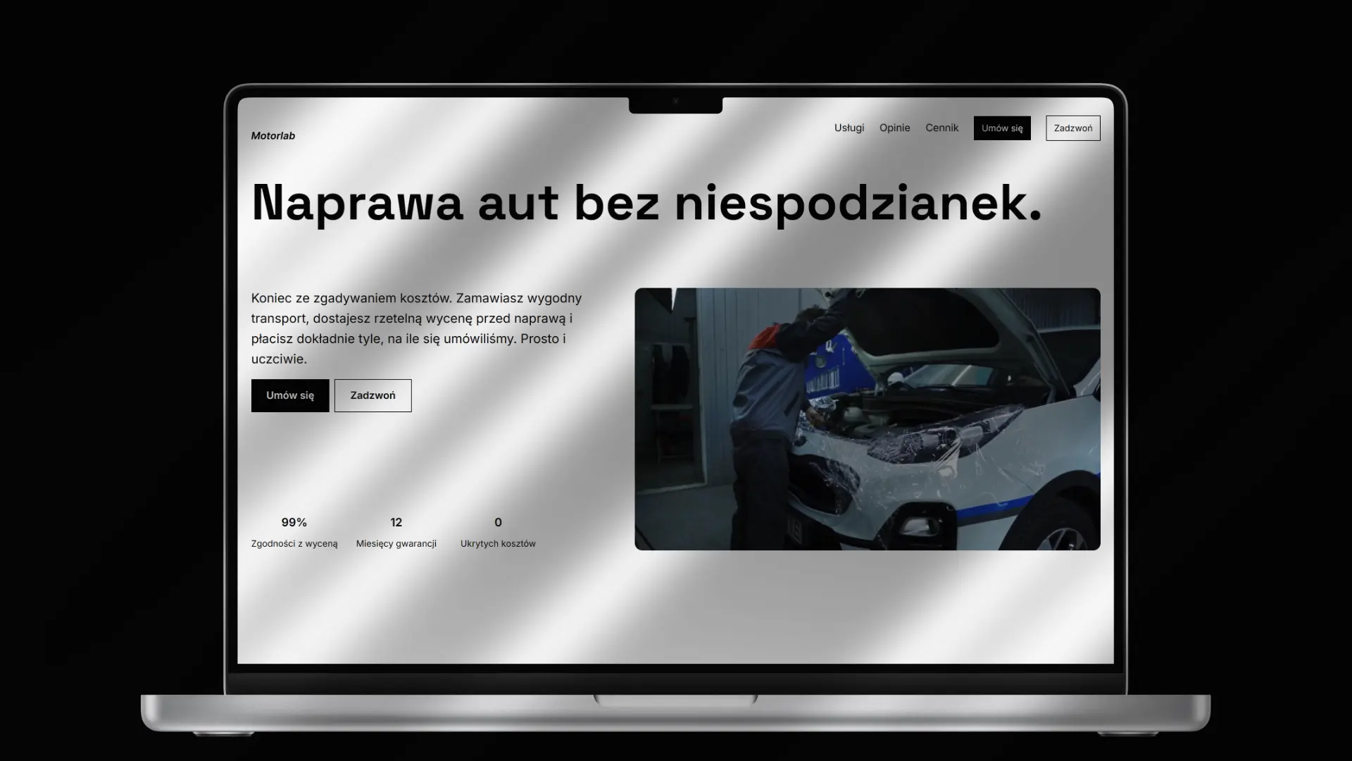 Makieta laptopa z widokiem na sekcję hero strony Motorlab z hasłem 'Naprawa aut bez niespodzianek'